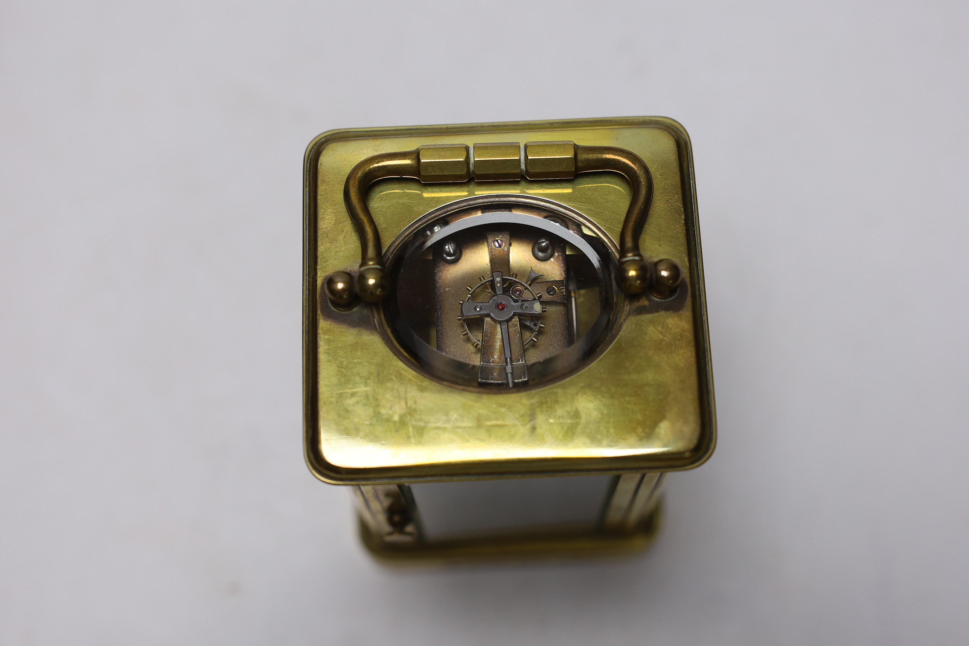 A Curtis brass carriage timepiece, in leather case, 15cm high